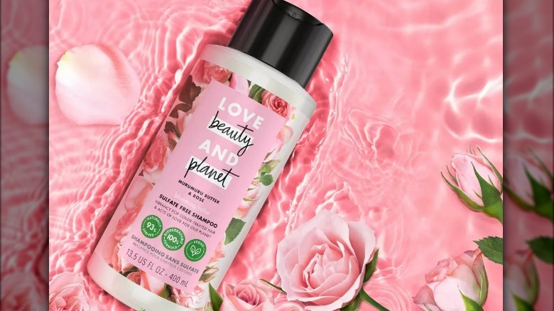 Pink shampoo bottle in water