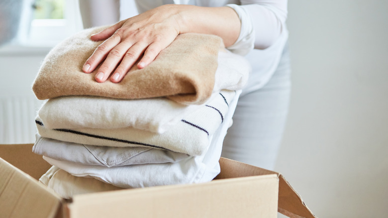 pile of clothes in a box