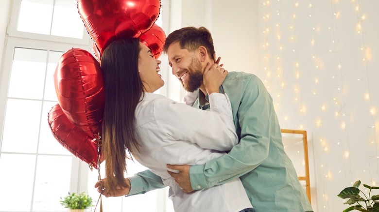 Happy couple with balloons