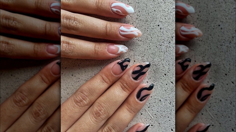 black and white swirl manicure 