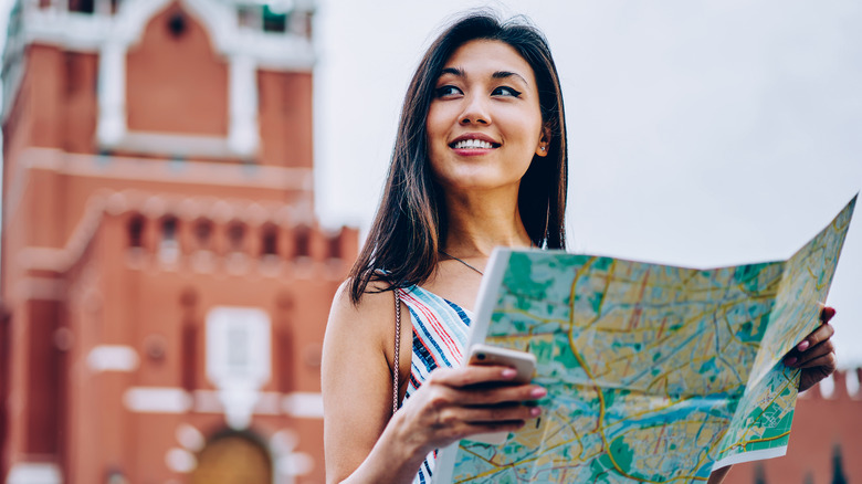 woman reading map