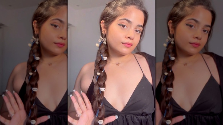 A woman with seashells in her braid