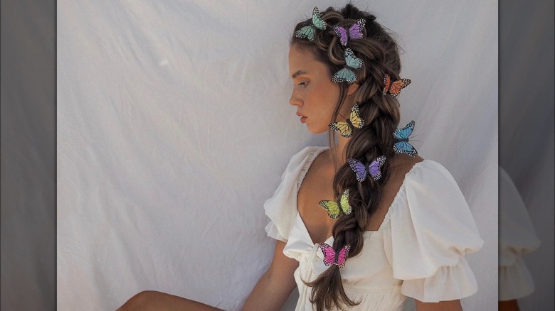 A woman with butterflies in her braid