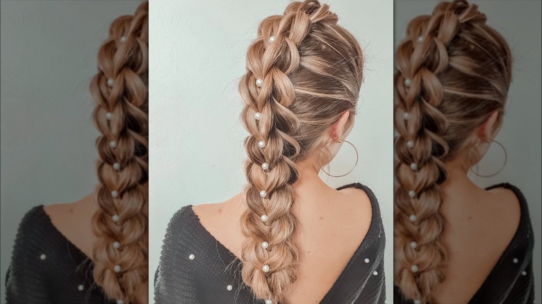 A woman with pearls in her braid