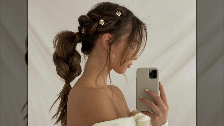 A woman with flowers in her braid