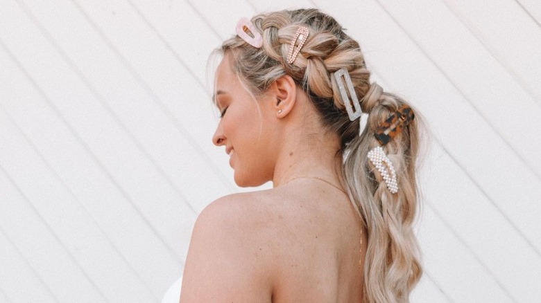 A woman with hair clips in her braid