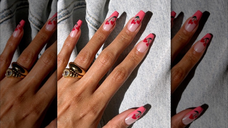 Barbiecore manicure with cherry hearts