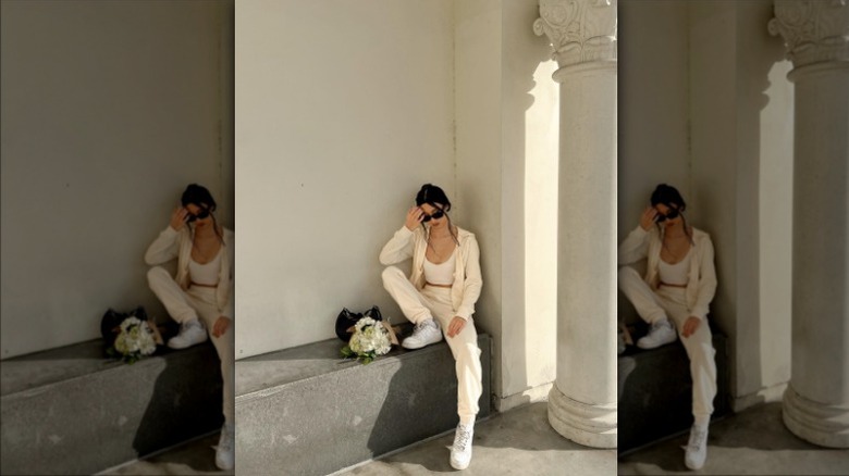 woman wearing cream sweatsuit