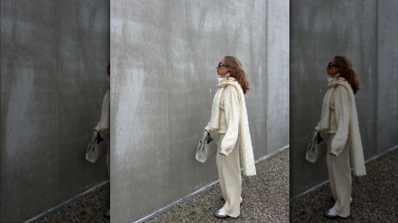 woman wearing cream textured clothes