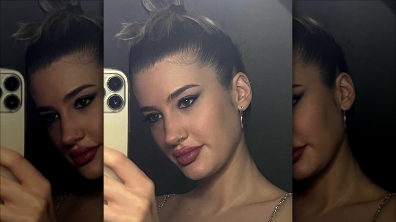 woman with slicked back messy bun