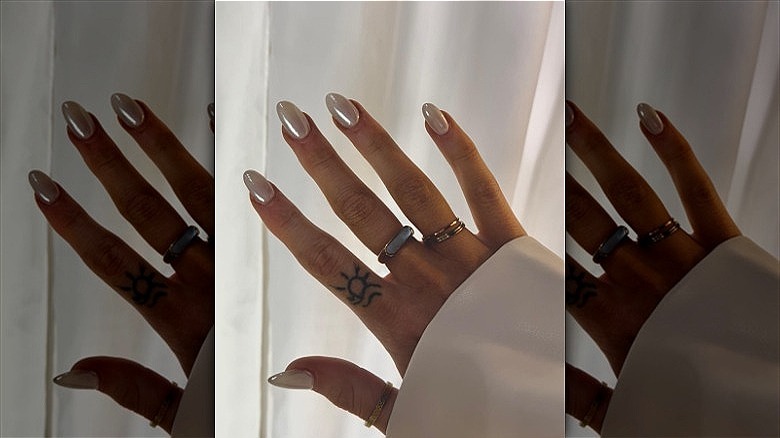 woman with glazed donut nails