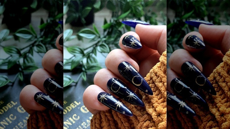 woman wearing moon and star nails