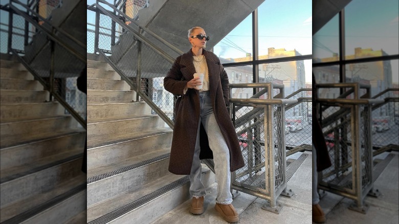 Woman in duster coat and Uggs