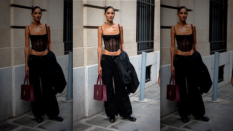 woman wearing sheer black corset top