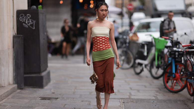 woman walking in tube dress