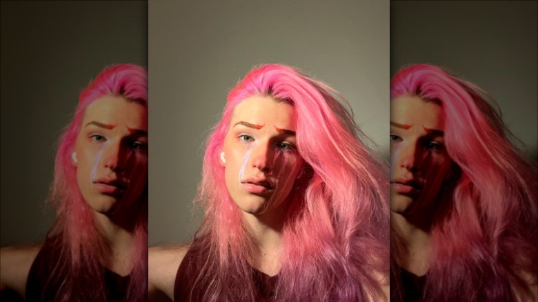 woman wearing red graphic eyeliner