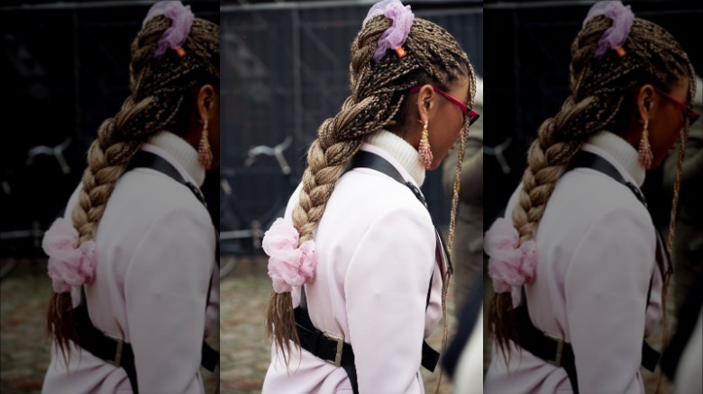woman wearing two scrunchies on braid