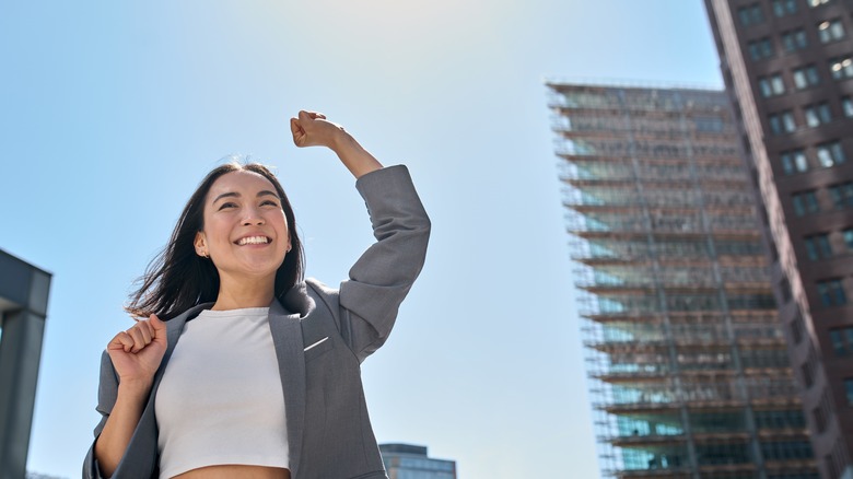 Woman cheering, fist in air