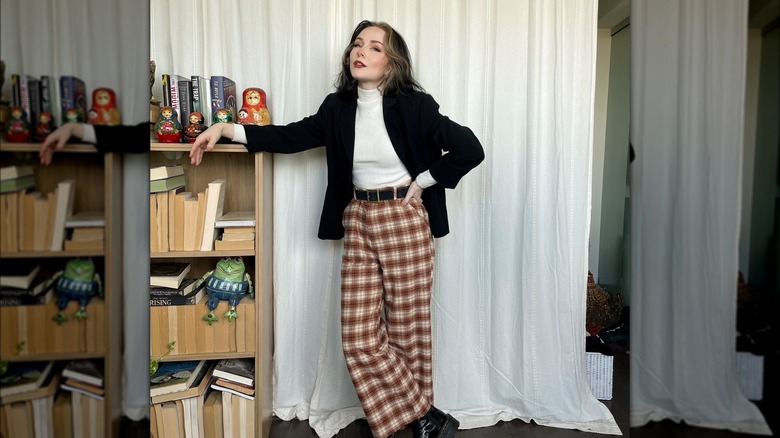 woman standing by bookcase