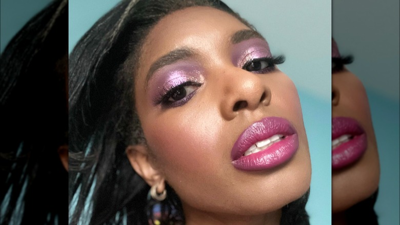 A woman with pink eye makeup