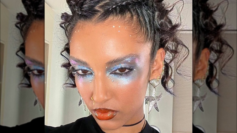 A woman with metallic makeup