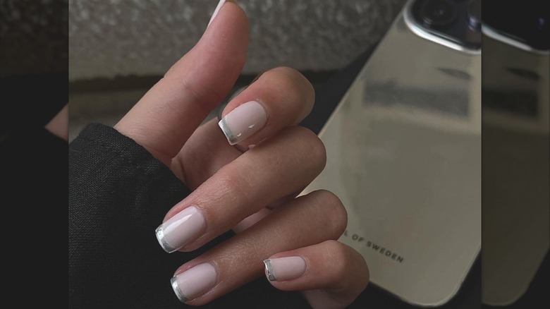 woman wearing chrome french manicure