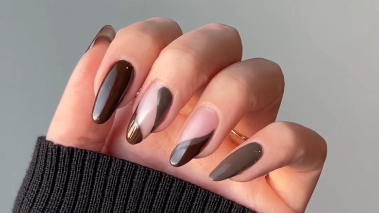 hand with brown alternative french manicure