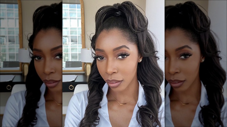red-haired woman standing on beach