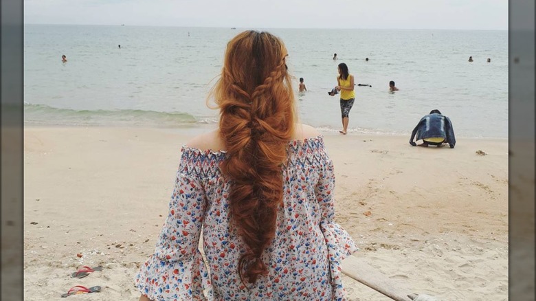 woman braid on beach