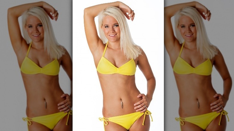 woman with belly button piercing