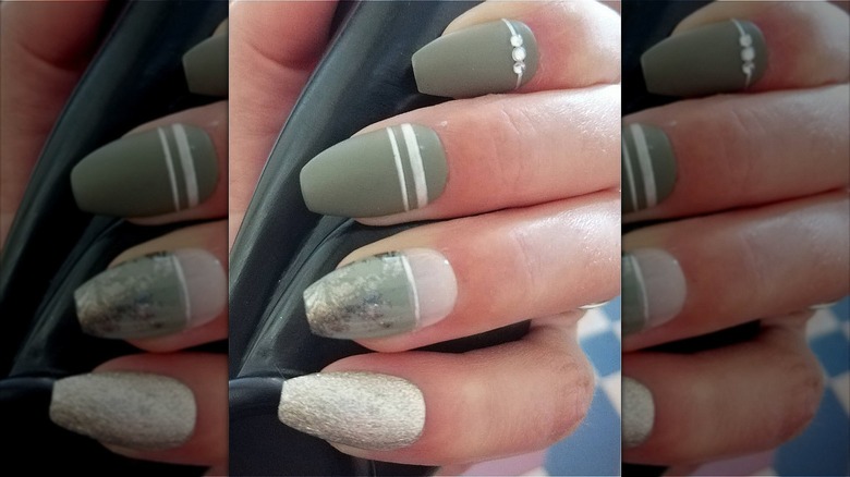 hand with green geometric coffin nails