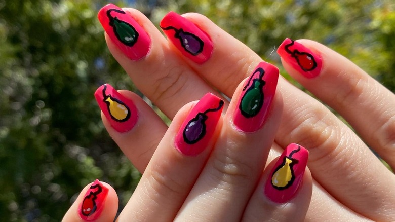 hands with balloon coffin nails