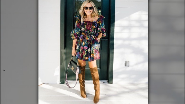 Woman wearing mini dress boots