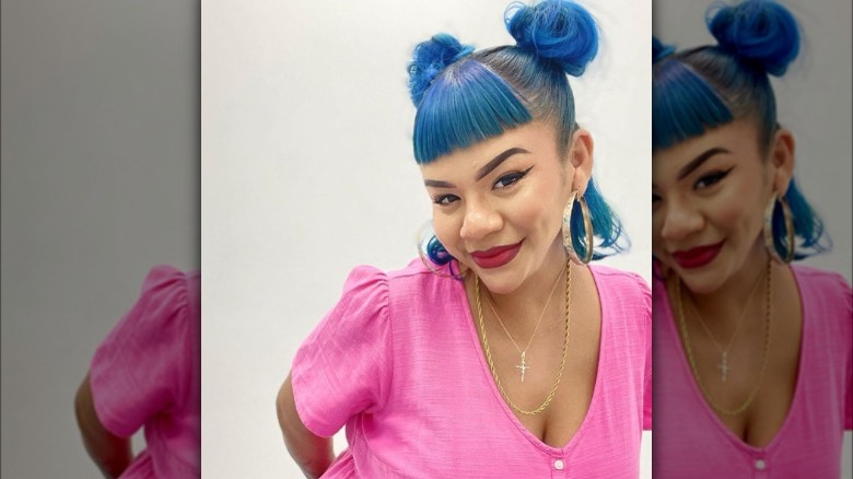 Woman with two space buns