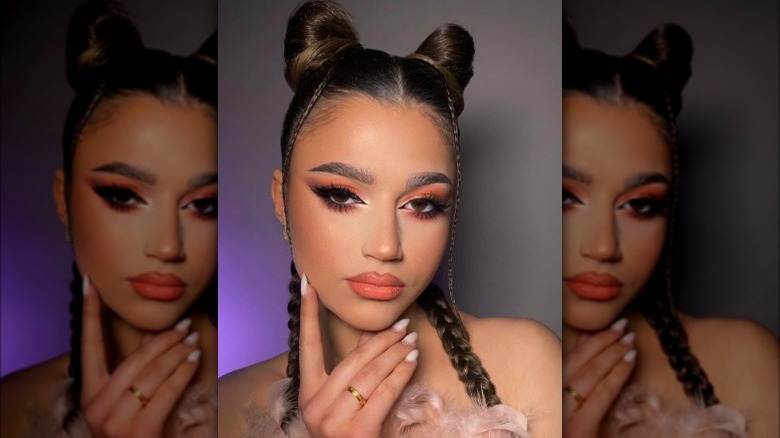 Woman with space buns and braids