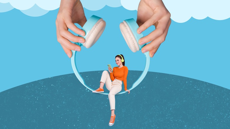 woman sitting in pair of headphones listening to podcast