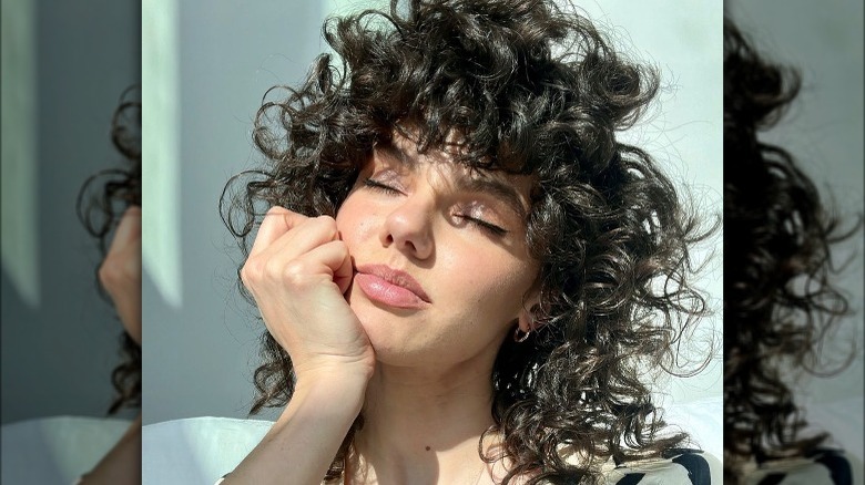 curly shag haircut long bangs