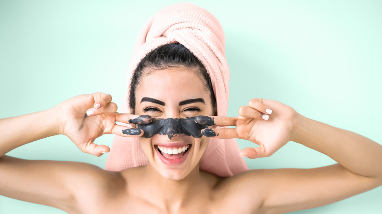 woman applying a face mask