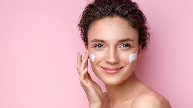 woman using a face cream