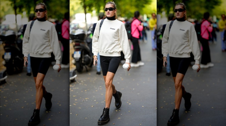 Woman wearing bike shorts and Doc Martens