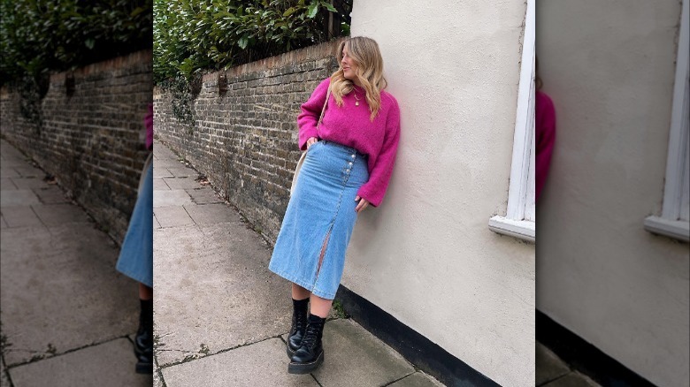 Woman in midi denim skirt and Doc Martens