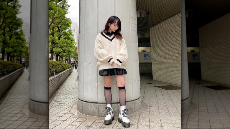 Woman in knee-high socks and Doc Martens