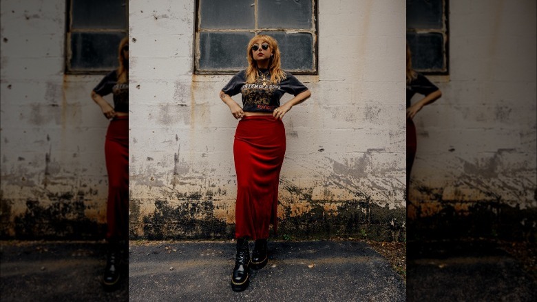 Woman in red maxi skirt and Doc boots