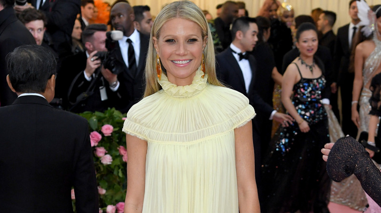 Gwyneth Paltrow in yellow gown, smiling