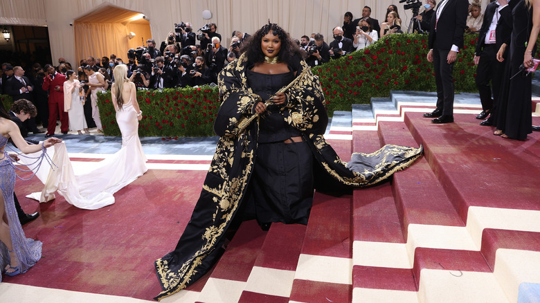 Lizzo wearing black and gold