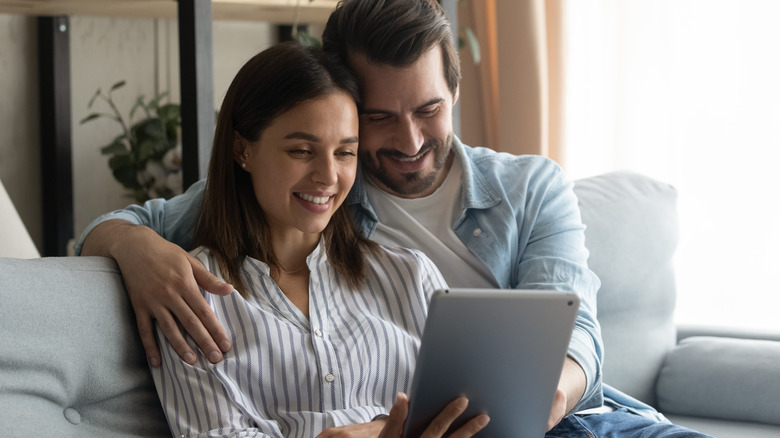 Couple using tablet together