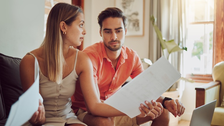 Couple sitting, having serious conversation