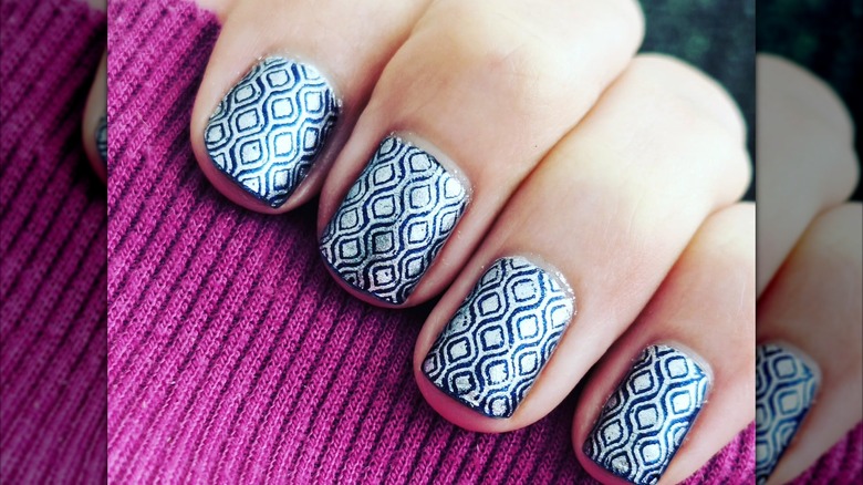 An art-deco manicure with blue-and-silver nails