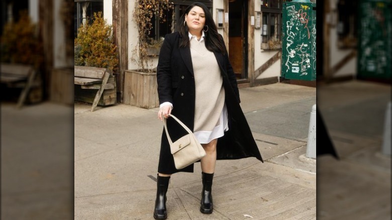 Woman in black trench coat