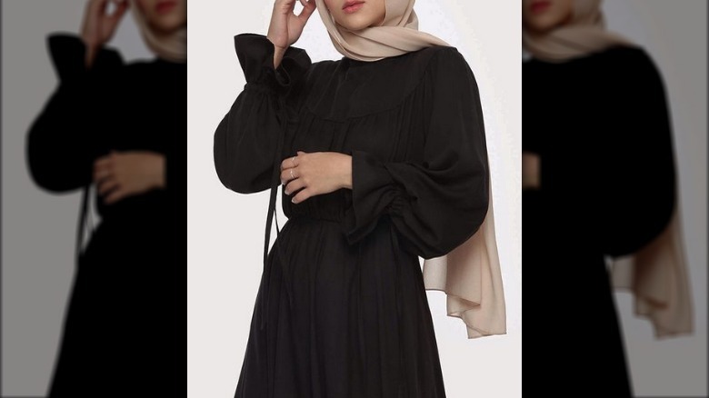 Hijabi woman in black dress